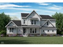 Charming two-story home with stone accents, inviting porch, and beautifully landscaped front yard at 1465 Old Hickory Ln, Westfield, IN 46074