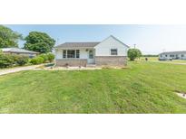 Charming single Gathering home featuring a well-manicured lawn and stone accents at 272 Jefferson St, Columbus, IN 47201
