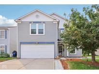 Charming two-story home with a two-car garage, well-maintained lawn, and inviting curb appeal at 2887 Ludwig Dr, Indianapolis, IN 46239