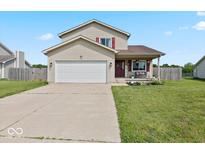Charming two-story home with a well-manicured lawn and a two-car garage, perfect for suburban living at 4605 Clairmont Dr, Columbus, IN 47203