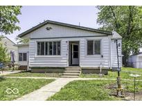Charming single-story home with a well-maintained lawn and welcoming entrance at 719 Melvenia St, Indianapolis, IN 46219