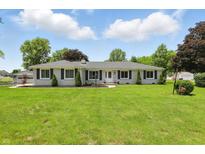 Charming single-story home with a spacious front yard and well-maintained landscaping at 8510 N Carroll Rd, Indianapolis, IN 46236