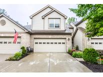 Charming two-story home with brick and siding, landscaped front yard, and attached two-car garage at 9263 Wadsworth Ct, Fishers, IN 46037