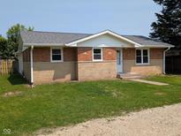 Charming single-story brick home with a well-maintained lawn and a new roof at 1359 S Mulberry St, Martinsville, IN 46151