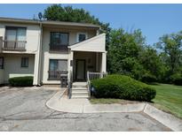 Charming two-story townhome with a cozy front porch and well-maintained landscaping at 4486 Abby Creek Ln, Indianapolis, IN 46205