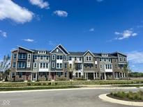 New townhome exteriors with varied colors offer an attractive design at 7313 Bayview Run, McCordsville, IN 46055