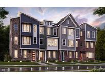 View of the new construction townhomes featuring brick and siding exteriors, colorful doors, and manicured lawns at 7339 Bayview Run, McCordsville, IN 46055