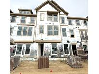 New construction home with lots of windows and currently under construction with brick pallets in front at 7347 Bayview Run, McCordsville, IN 46055