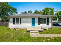 Charming ranch home with a well-maintained lawn, blue front door, and classic curb appeal at 120 Hoss Rd, Indianapolis, IN 46217