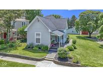 Charming home with lovely landscaping, updated siding, and a welcoming front porch at 1539 Evans Ave, Noblesville, IN 46060