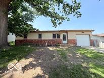 Charming one-story home with a brick facade and mature shade trees at 3106 Southwest Dr, Indianapolis, IN 46241