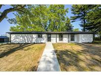 Charming one-story home with a minimalist modern design and well-manicured lawn at 496 N County Road 325 W, Danville, IN 46122