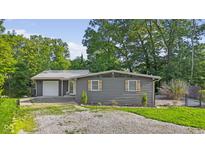 Charming home with gray siding, decorative shutters, and a well-maintained front yard at 5570 Paradise Ct, Martinsville, IN 46151