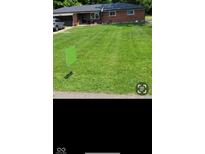 Charming brick ranch-style home with a well-maintained front yard at 8990 N 850 W, Fairland, IN 46126