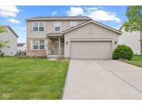 Charming two-story home with attached two car garage, manicured lawn, and inviting front porch at 11105 Deer Valley Dr, Indianapolis, IN 46229