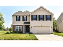 Charming two-story home with a well-manicured lawn and a two-car attached garage at 12343 Slate Dr, Fishers, IN 46037
