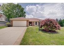 Attractive home with a large driveway and beautifully landscaped front yard for outdoor enjoyment at 12515 Traverse Pl, Fishers, IN 46038