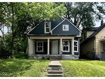 Charming two-story home with a covered front porch and freshly painted exterior at 2955 N Olney St, Indianapolis, IN 46218