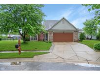 Charming single-Gathering home featuring a well-maintained lawn, brick facade, and inviting curb appeal at 4442 Victory Cir, Indianapolis, IN 46203