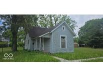 Charming exterior view of a cozy home with a neat roof and pleasant architectural details at 479 W Pike St, Martinsville, IN 46151
