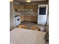 Cozy kitchen with classic countertops, traditional cabinets, and linoleum flooring at 5807 Sunwood Dr, Indianapolis, IN 46224
