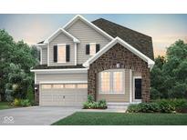Charming two-story home featuring stone accents, neutral siding, and well-manicured landscaping at 7211 Stetson Dr, Whitestown, IN 46075