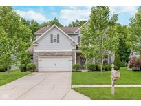 Charming two-story home featuring a two-car garage, stone accents, manicured lawn, and inviting curb appeal at 8556 N Deer Hill Dr, McCordsville, IN 46055