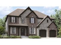 Inviting two-story home featuring a blend of brick and stone with a two-car garage at 1919 Delp Ct, Avon, IN 46123