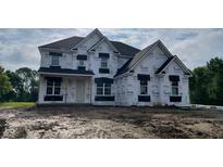 Two-story home with white exterior and black accents under construction, ready to be personalized with landscaping at 1919 Delp Ct, Avon, IN 46123