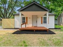 Charming home featuring a quaint front porch and lovely light-colored exterior at 5136 Miller St, Indianapolis, IN 46241