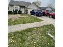 Ranch home featuring a tidy front yard, bay window, and attached two car garage at 8457 Kousa Dr, Indianapolis, IN 46234