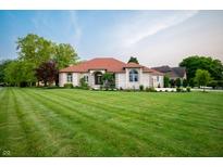 Charming single-story home with well-manicured lawn and brick exterior at 8703 Gordonshire Dr, Indianapolis, IN 46278