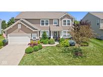Charming two-story home with landscaped yard and attached two-car garage at 1294 Vista Way, Greenwood, IN 46143