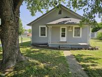 Charming single-story home with a welcoming front porch and well-maintained lawn at 2041 Mckinley Ave, Columbus, IN 47201
