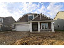 Charming new construction home featuring a covered porch and an attached two-car garage at 10132 Redwood Peak Ln, Indianapolis, IN 46259