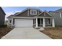 Charming single-Gathering home featuring brown siding, stone accents, and a spacious two-car garage at 10132 Redwood Peak Ln, Indianapolis, IN 46259