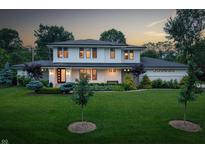 Stunning two-story home with a well-manicured lawn and elegant landscaping at 5946 Stafford Way, Indianapolis, IN 46228