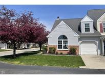 Charming home with a well-manicured lawn, beautiful landscaping, and a single-car garage in a residential neighborhood at 9664 Legare St # 2601, Fishers, IN 46038
