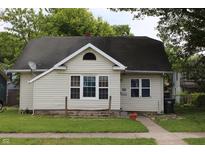 Charming single-story home with neutral siding, black roof and well-maintained lawn at 2232 Fairview St, Anderson, IN 46016
