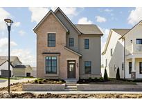 Charming two-story home boasts a mix of brick and siding and professional landscaping at 1655 Fernley Dr, Westfield, IN 46074