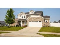 Beautiful two-story home featuring stone accents, a gray roof, and an attached two-car garage at 18297 Rickety Dr, Westfield, IN 46074