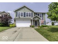 Charming two-story home with a well-manicured lawn, attached garage, and an inviting front porch at 2786 Longleaf Dr, Greenwood, IN 46143