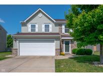 Two-story home featuring a two car garage, neutral siding and partial stone accents plus manicured lawn at 3010 Underwood Ct, Whiteland, IN 46184