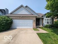 Charming single-Gathering home with well-maintained landscaping, a two-car garage, and a welcoming entrance at 3714 Turfway Ct, Indianapolis, IN 46228