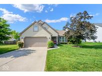 Charming home with a two-car garage, beautiful landscaping, and a well-maintained lawn at 4342 Sequoia Ct, Greenwood, IN 46143