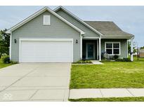 Charming single Gathering home with a two-car garage, manicured lawn, and quaint front porch at 7611 Cloudy Ct, Camby, IN 46113