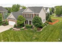 Beautiful two-story home with a well-manicured lawn and mature trees providing curb appeal at 1237 Wolcott Ct, Westfield, IN 46074