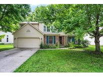 Charming two-story home with a well-manicured lawn and attached two-car garage in a quiet neighborhood at 1264 Black Oak Dr, Greenwood, IN 46143