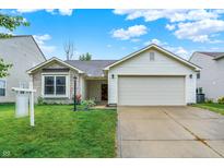 Charming single-Gathering home with a well-manicured lawn and two car garage on a sunny day at 15523 Follow Dr, Noblesville, IN 46060