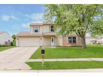 Charming two-story home features a well-manicured lawn, brick accents, and a welcoming front entrance at 6320 River Valley Way, Indianapolis, IN 46221